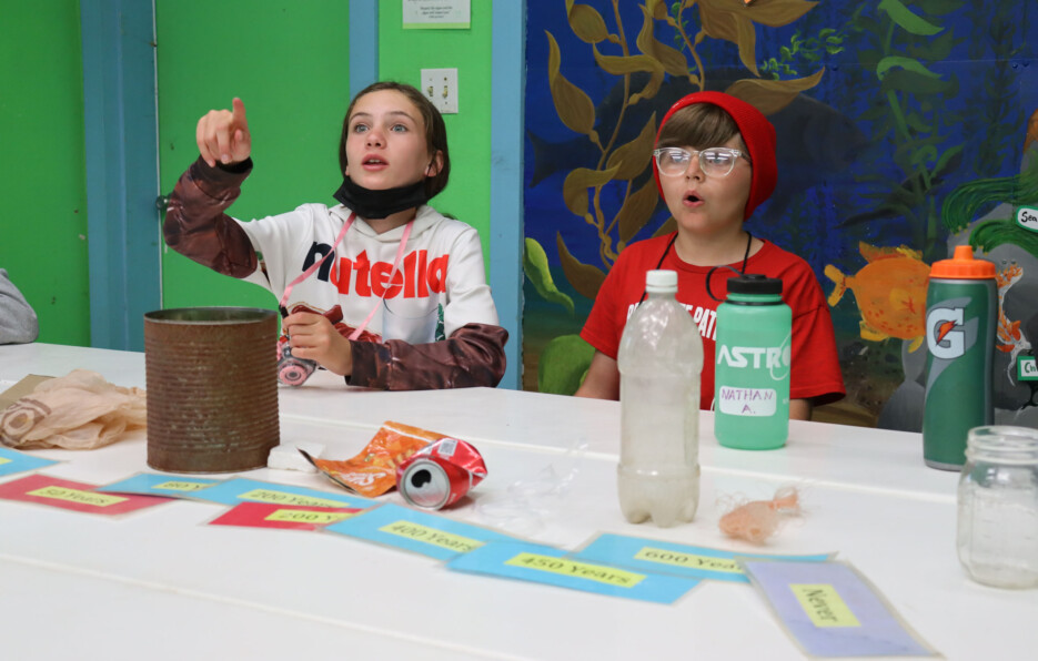 Kids playing with plastics.