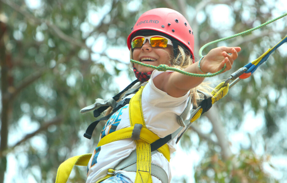 Girl in giant swing harness.