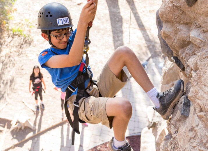 Boy rock-climbing.