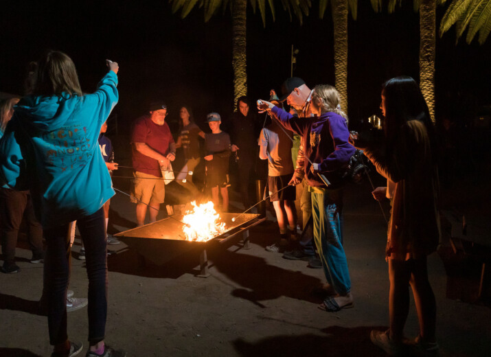 Group around campfire.