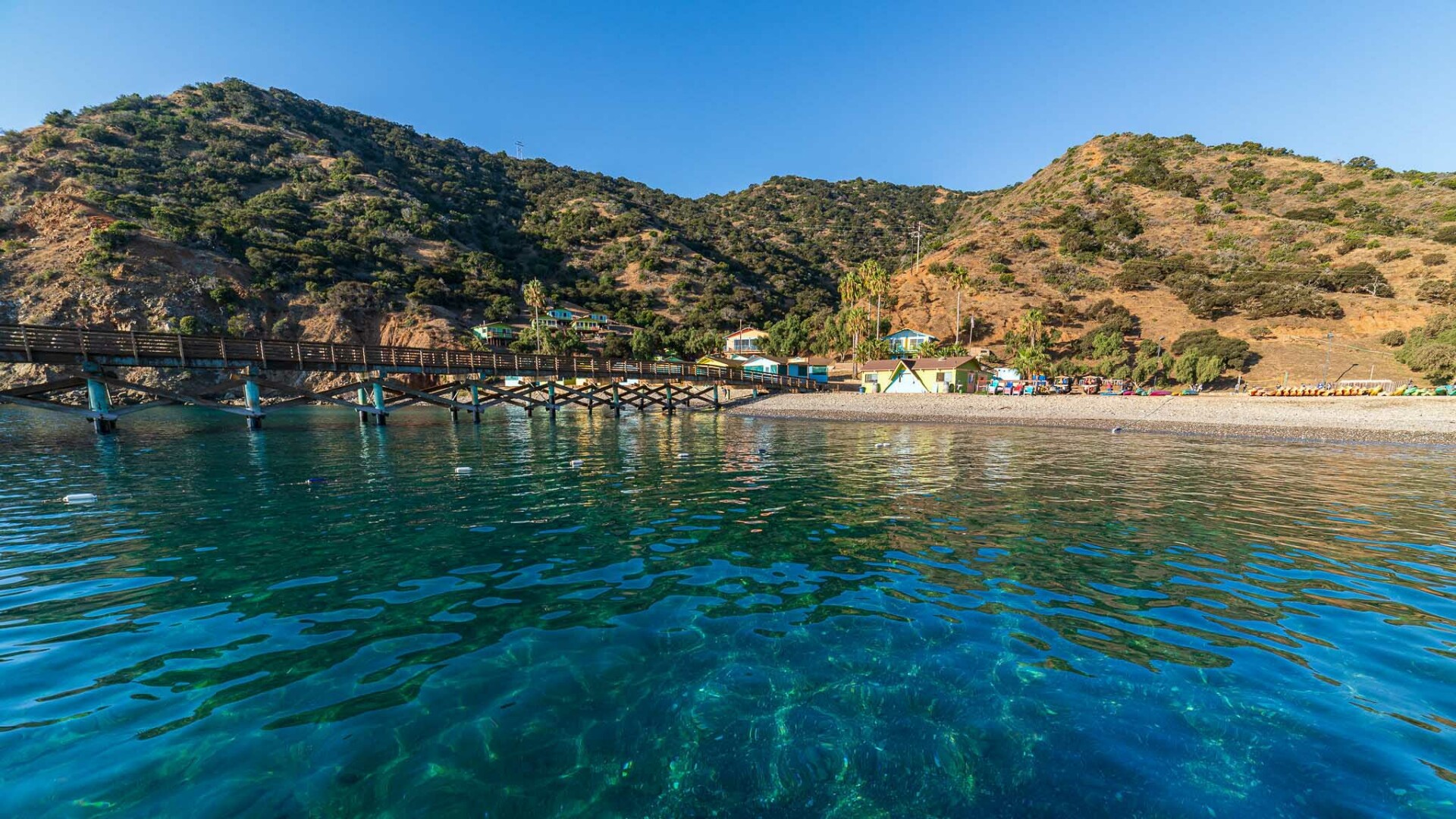 Waterfront beach view of land.